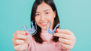 What Are the Main Differences Between Permanent and Plastic Retainers